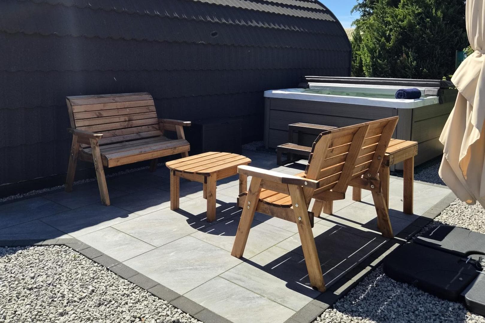 Bench seating beside the hot tub on the patio