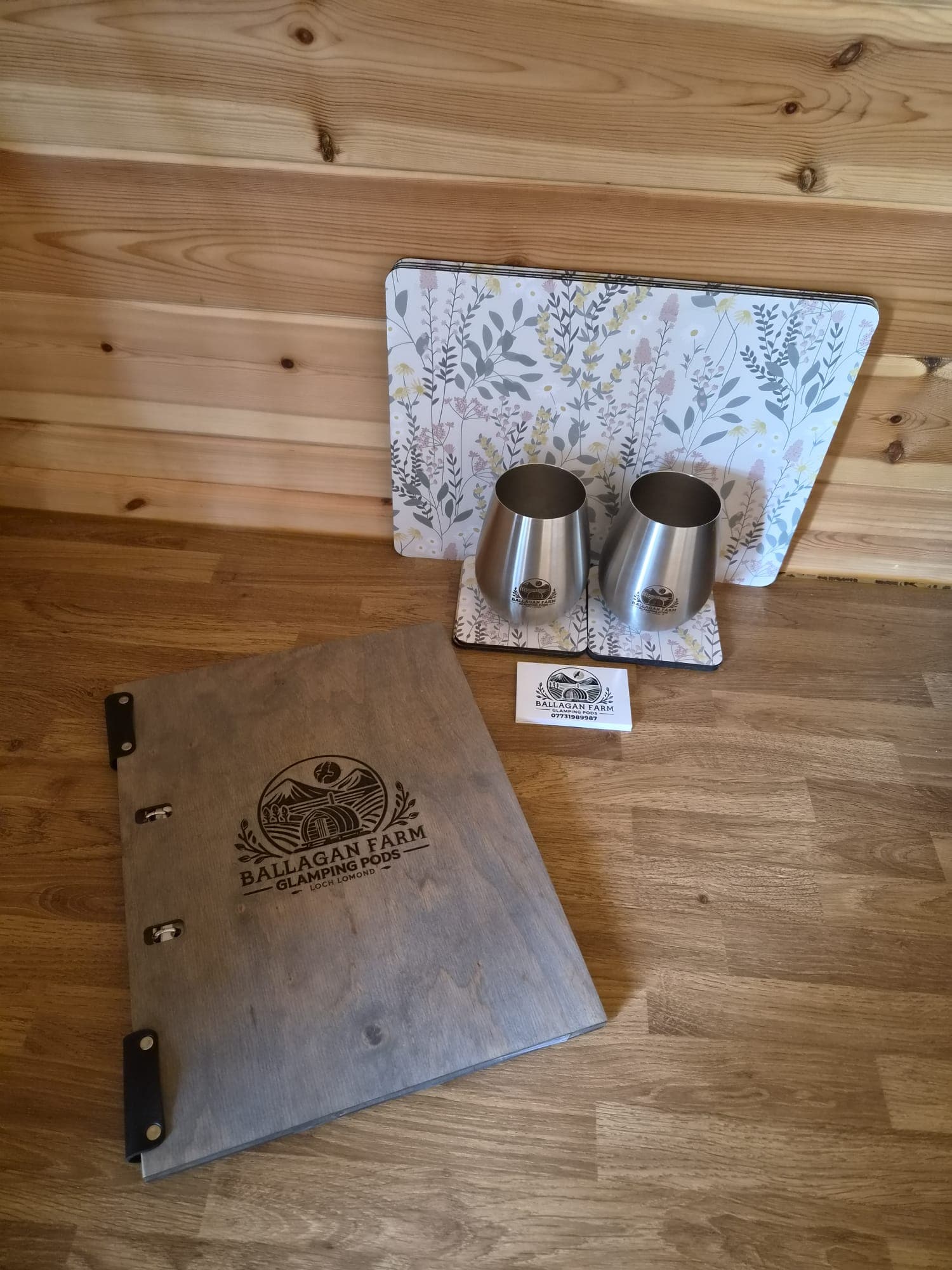 A welcome pack of Ballagan Farm coasters, cups and a guest folder